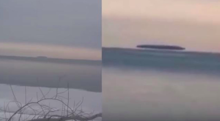 Impactante grabación de un enorme objeto que parece estar suspendido sobre un lago